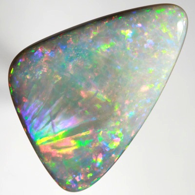 SOLID SEMI BLACK OPAL Very unual opal with an exploding rainbow. SEE VIDEO  